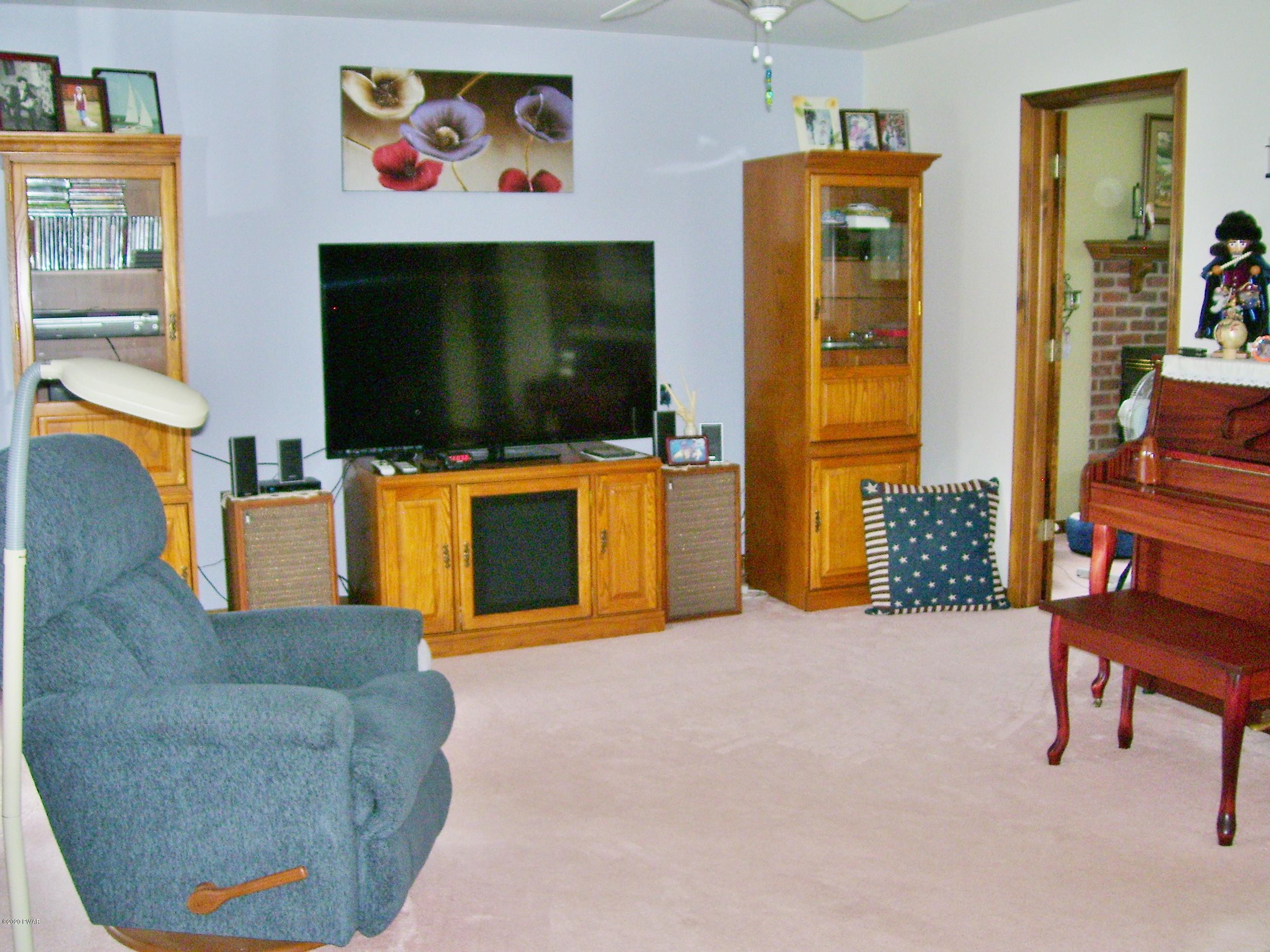 50 Layton Road Waymart, PA 18472 - Photo 20 of 61 a living room with furniture and a flat screen tv