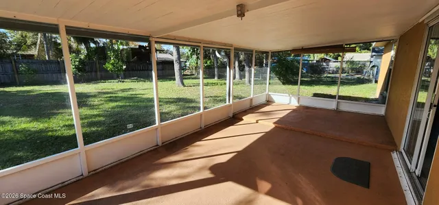 a view of an empty room and window