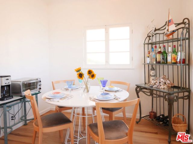a view of a dining room with furniture and window