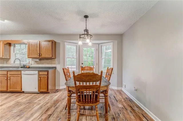 a dining room with furniture window wooden floor