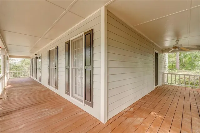 a view of a balcony with wooden floor