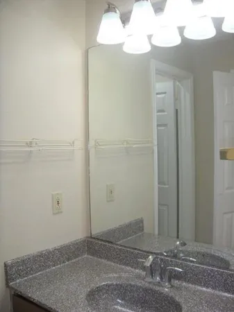 an empty room with a mirror