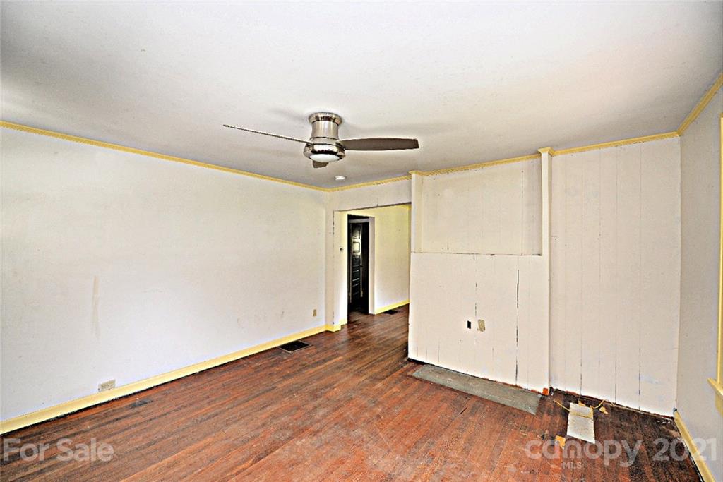 1 Sycamore Street Asheville, NC 28804 - Photo 14 of 46 a view of a room with wooden floor