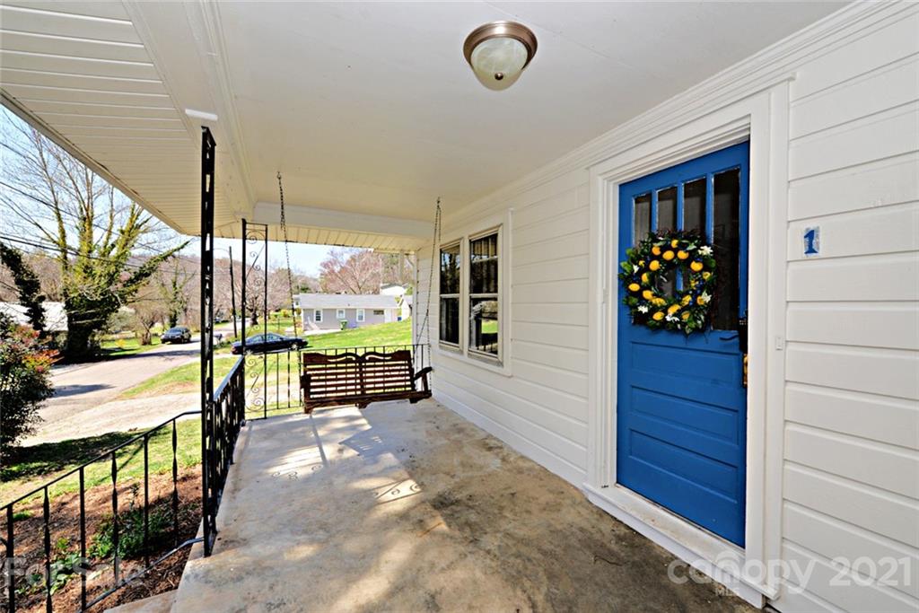 1 Sycamore Street Asheville, NC 28804 - Photo 3 of 46 a view of a porch with wooden floor and outdoor space