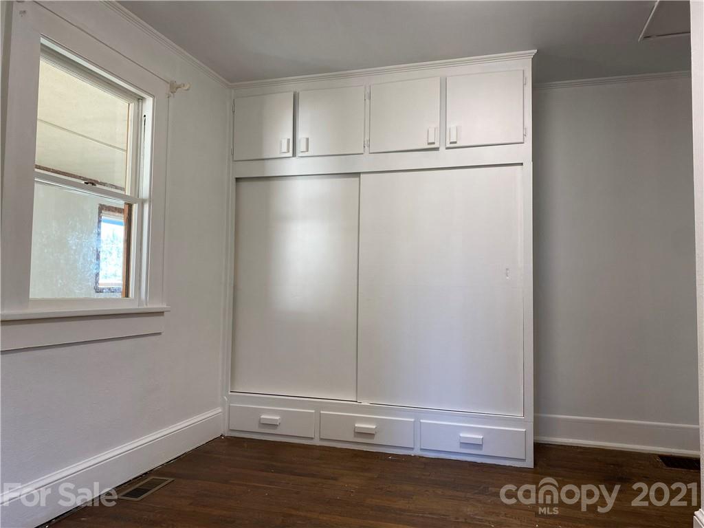 1 Sycamore Street Asheville, NC 28804 - Photo 22 of 46 a view of empty room with wooden floor