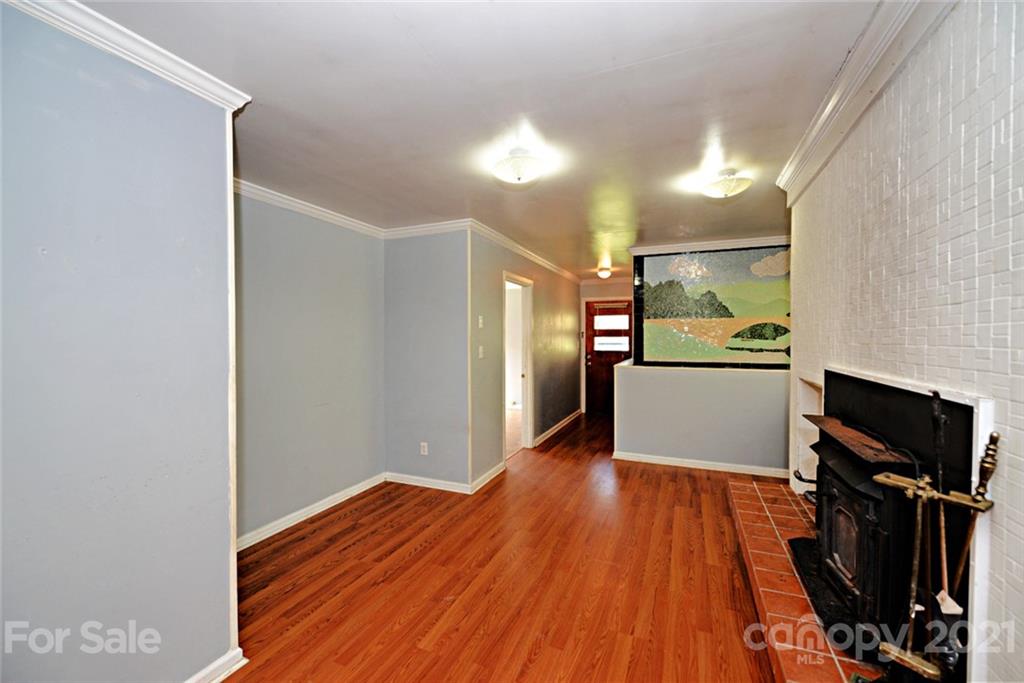 1 Sycamore Street Asheville, NC 28804 - Photo 31 of 46 a view of a kitchen with wooden floor and electronic appliances