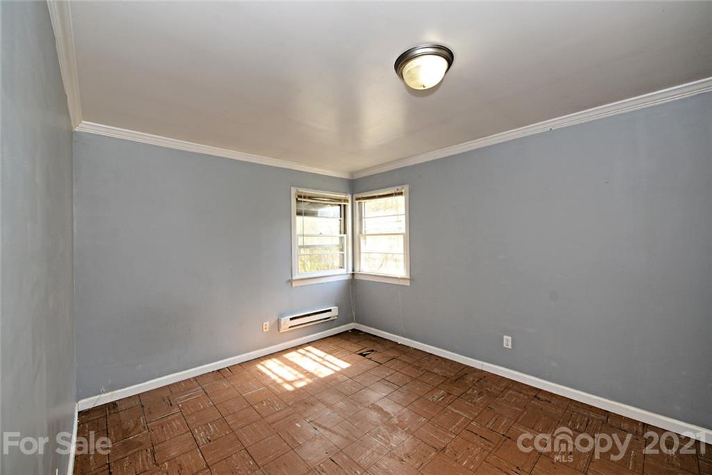 1 Sycamore Street Asheville, NC 28804 - Photo 34 of 46 an empty room with a window