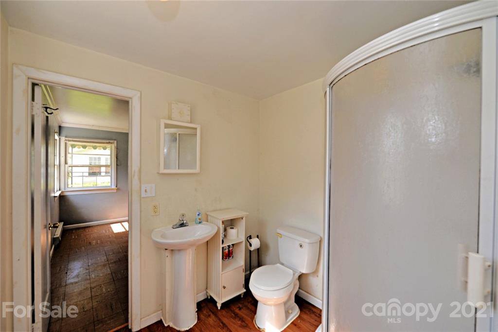 1 Sycamore Street Asheville, NC 28804 - Photo 36 of 46 a bathroom with a toilet and a shower