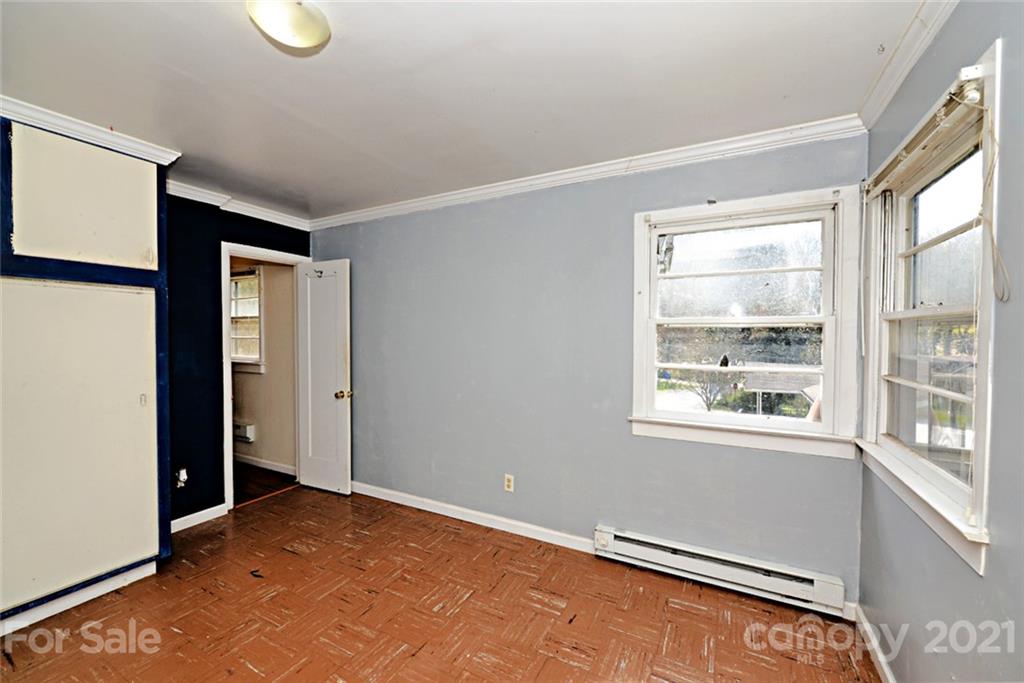 1 Sycamore Street Asheville, NC 28804 - Photo 38 of 46 a view of an empty room with a window