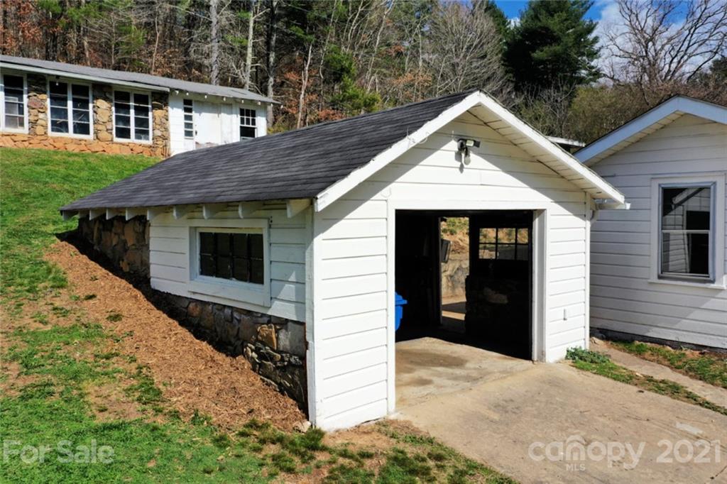 1 Sycamore Street Asheville, NC 28804 - Photo 39 of 46 a front view of a house with a yard and garage