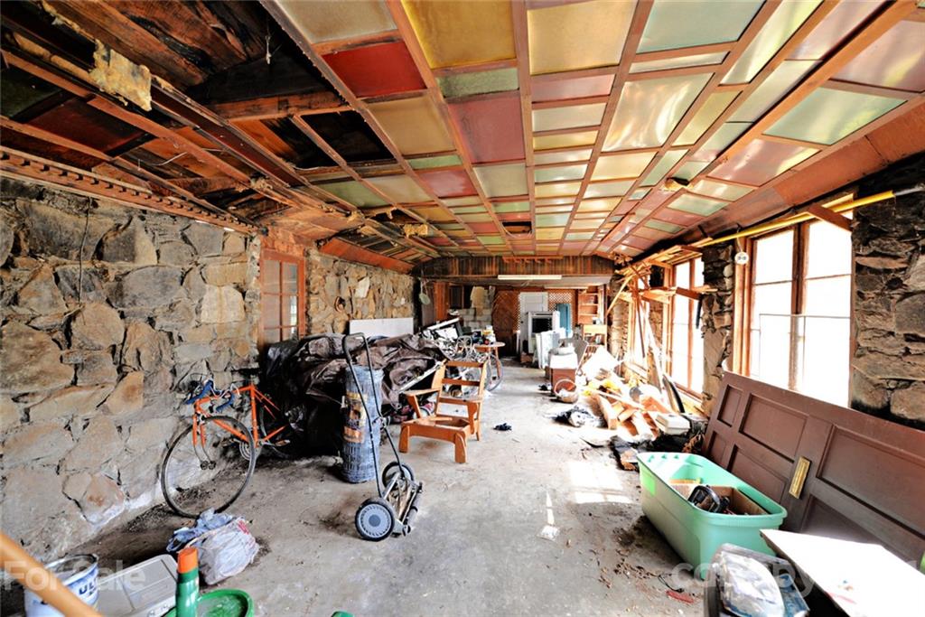 1 Sycamore Street Asheville, NC 28804 - Photo 42 of 46 a view of a room with gym equipment