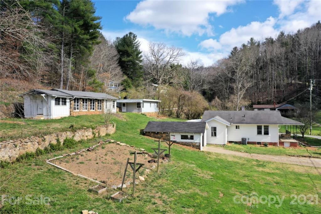 1 Sycamore Street Asheville, NC 28804 - Photo 9 of 46 a aerial view of a house with garden