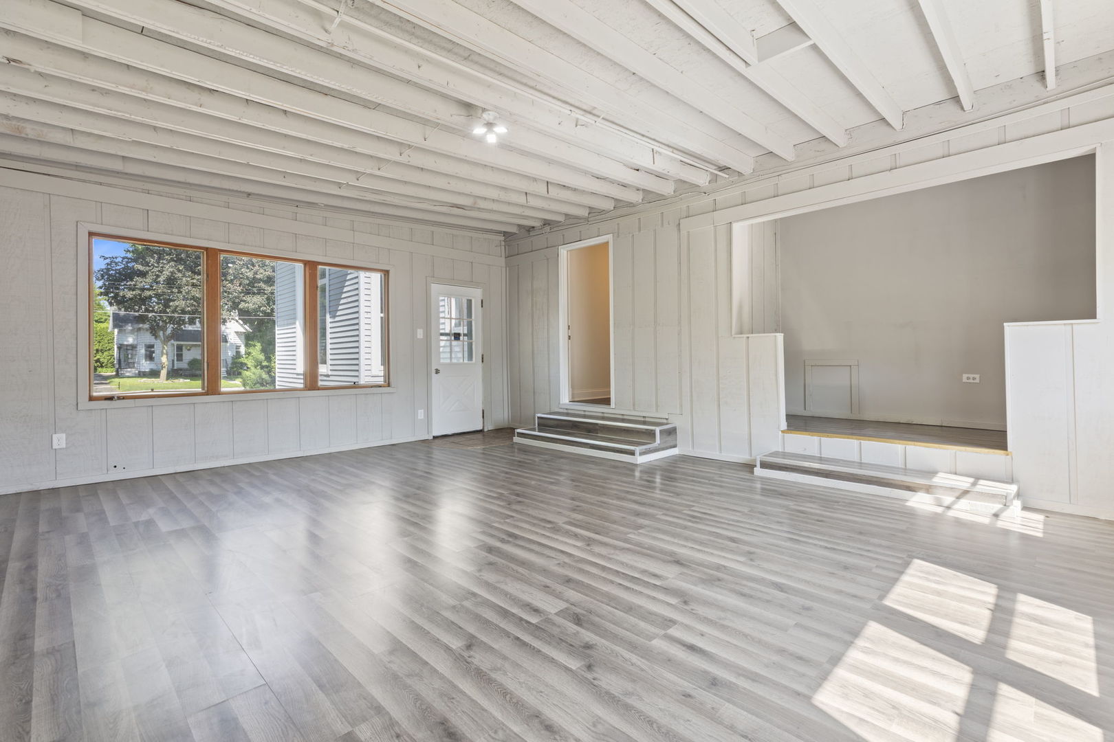 718 Sycamore Street Ottawa, IL 61350 - Photo 17 of 27 a view of an empty room with wooden floor and a window