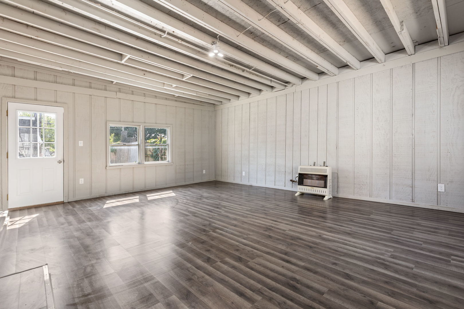 718 Sycamore Street Ottawa, IL 61350 - Photo 18 of 27 a view of an empty room with wooden floor and a window