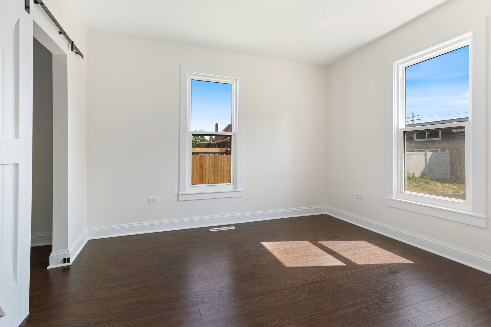 718 Sycamore Street Ottawa, IL 61350 - Photo 20 of 27 an empty room with wooden floor and windows