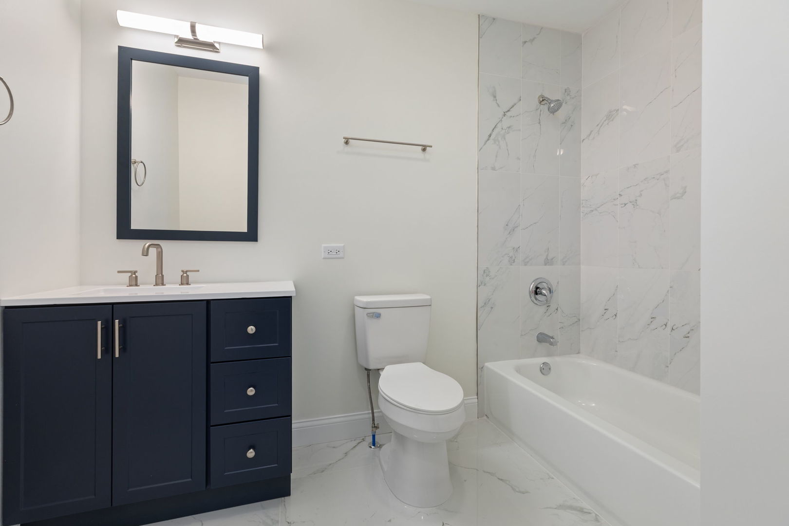 718 Sycamore Street Ottawa, IL 61350 - Photo 23 of 27 a bathroom with a sink vanity mirror bathtub and toilet