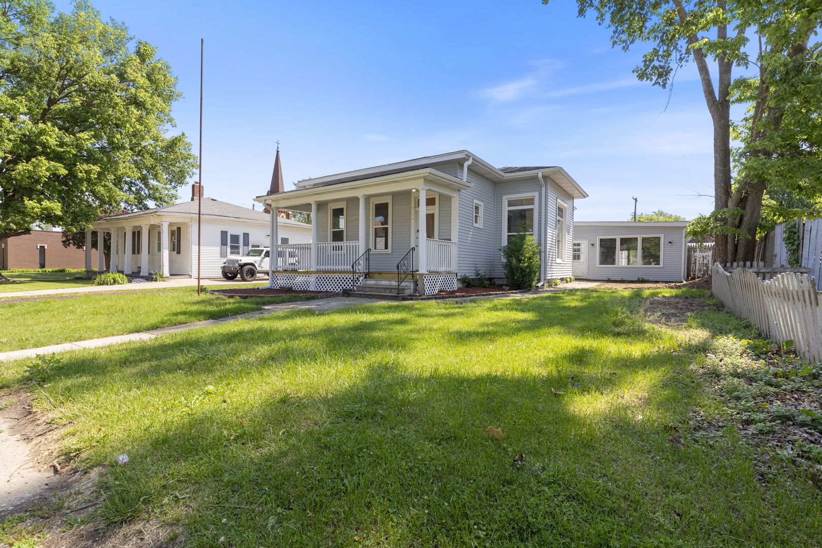 718 Sycamore Street Ottawa, IL 61350 - Photo 3 of 27 a view of a house with a big yard and large trees