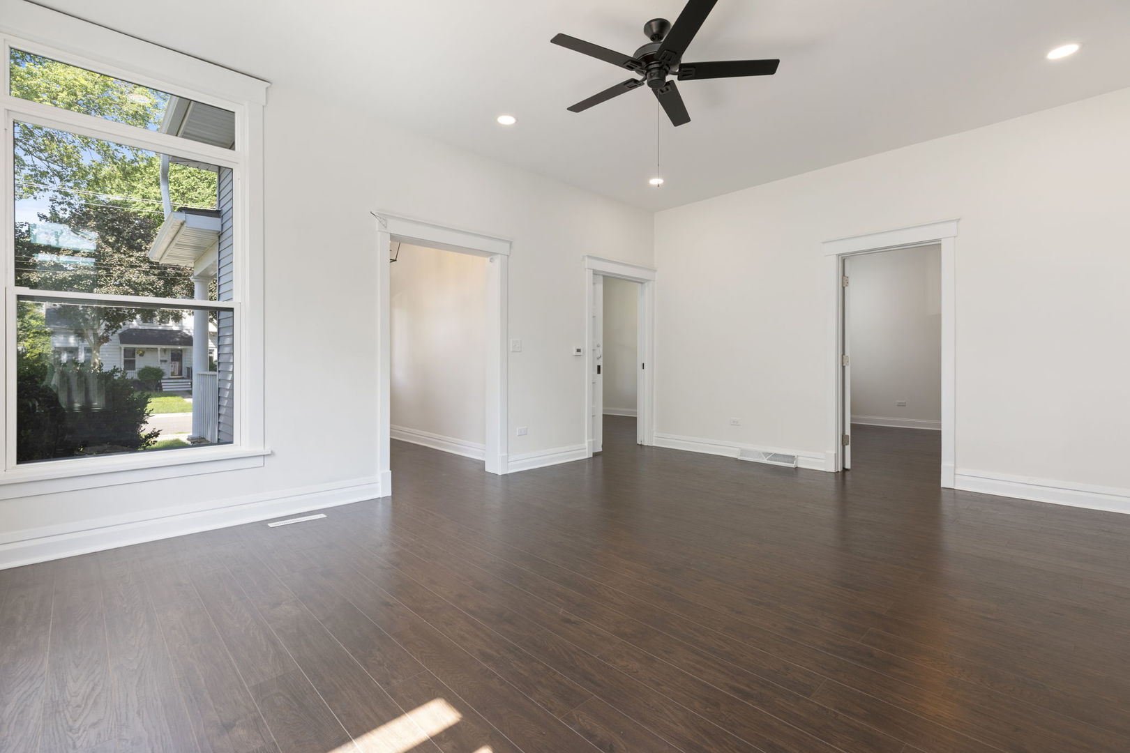 718 Sycamore Street Ottawa, IL 61350 - Photo 6 of 27 a view of a livingroom with a hardwood floor and a window