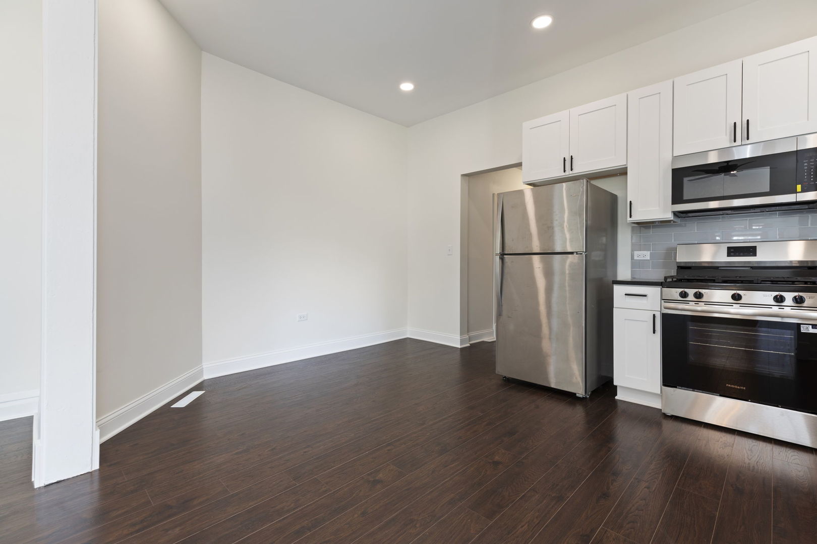 718 Sycamore Street Ottawa, IL 61350 - Photo 9 of 27 a view of kitchen with stainless steel appliances wooden floor and electronic appliances
