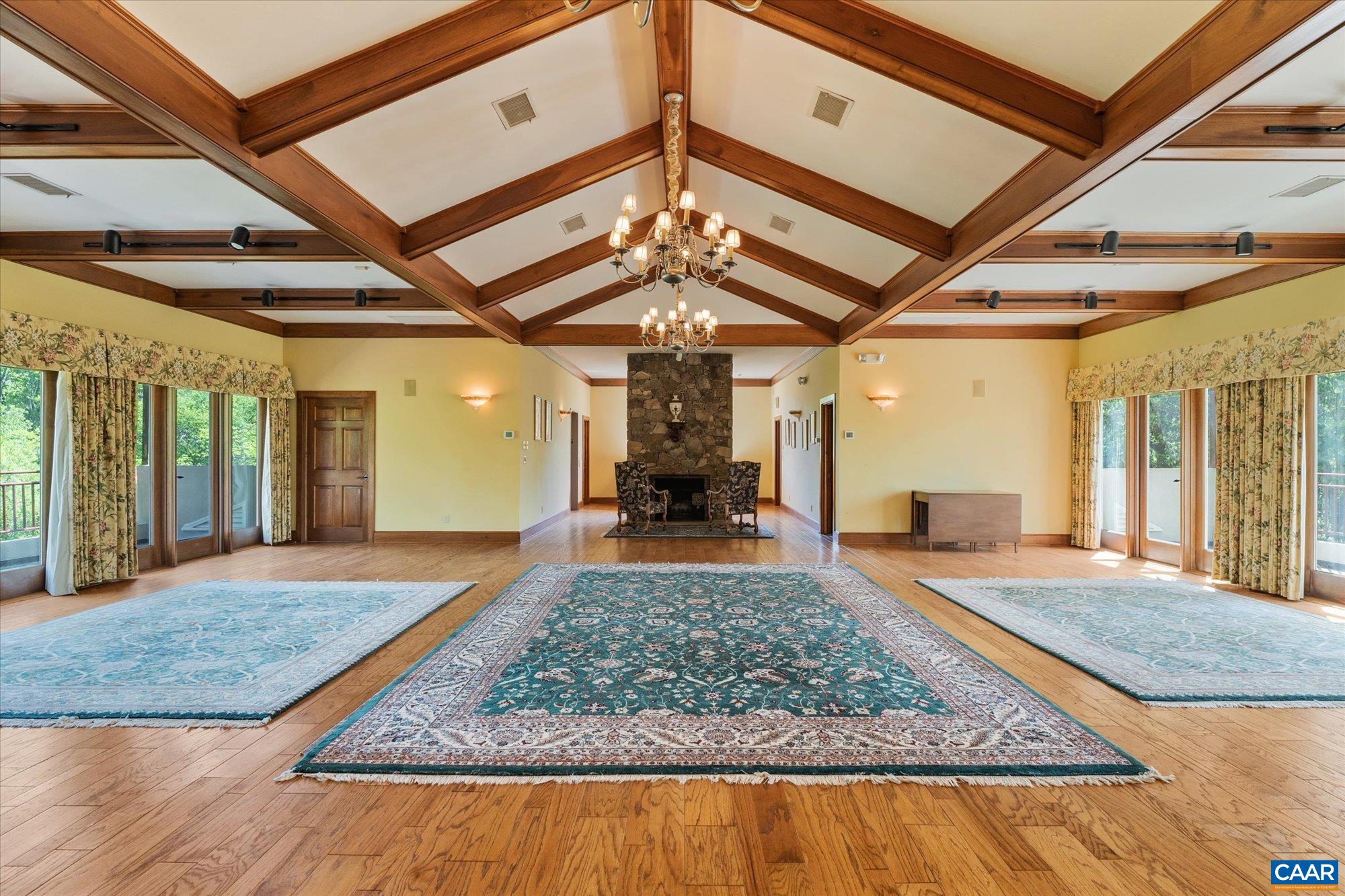 5190 Sugar Ridge Road Crozet, VA 22932 - Photo 57 of 69 a view of a hallway with a chandelier and fireplace