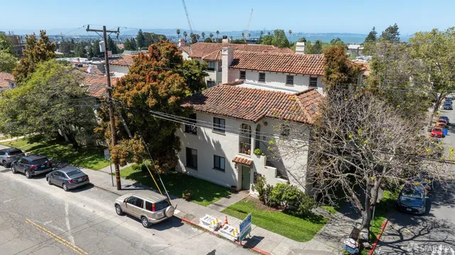 a view of a patio with table and chairs and potted plants