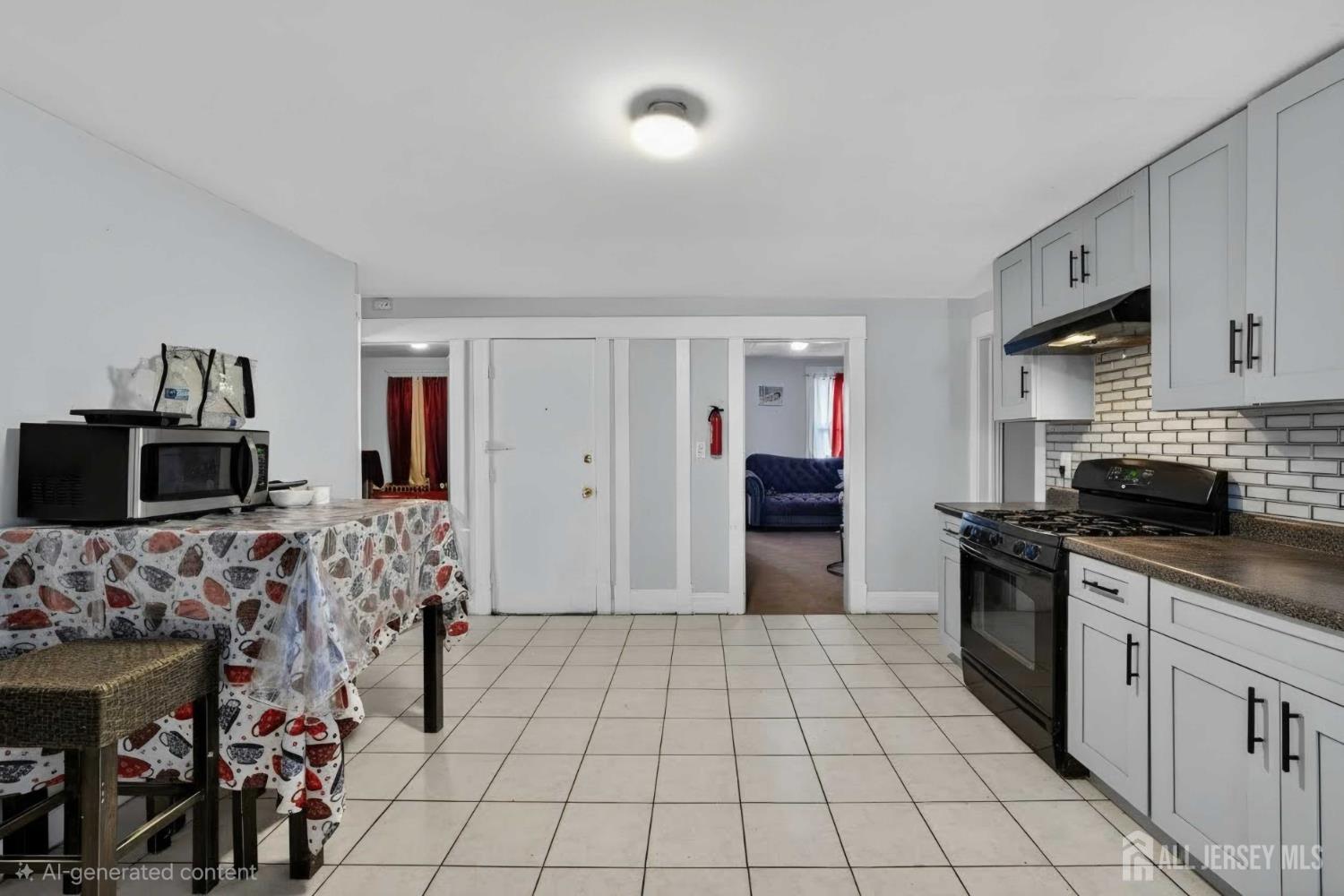 361 Prospect Street Perth Amboy, NJ 08861 - Photo 17 of 50 a kitchen with stainless steel appliances kitchen island granite countertop a refrigerator and a stove top oven
