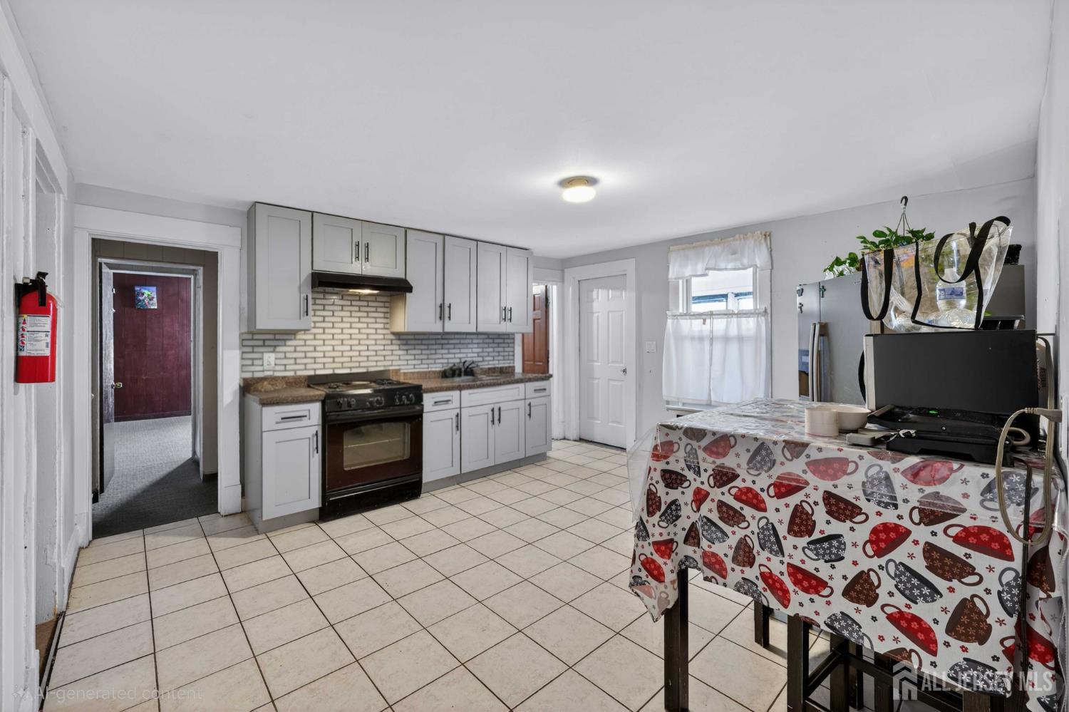 361 Prospect Street Perth Amboy, NJ 08861 - Photo 19 of 50 a open kitchen with stainless steel appliances granite countertop a stove a sink and a refrigerator