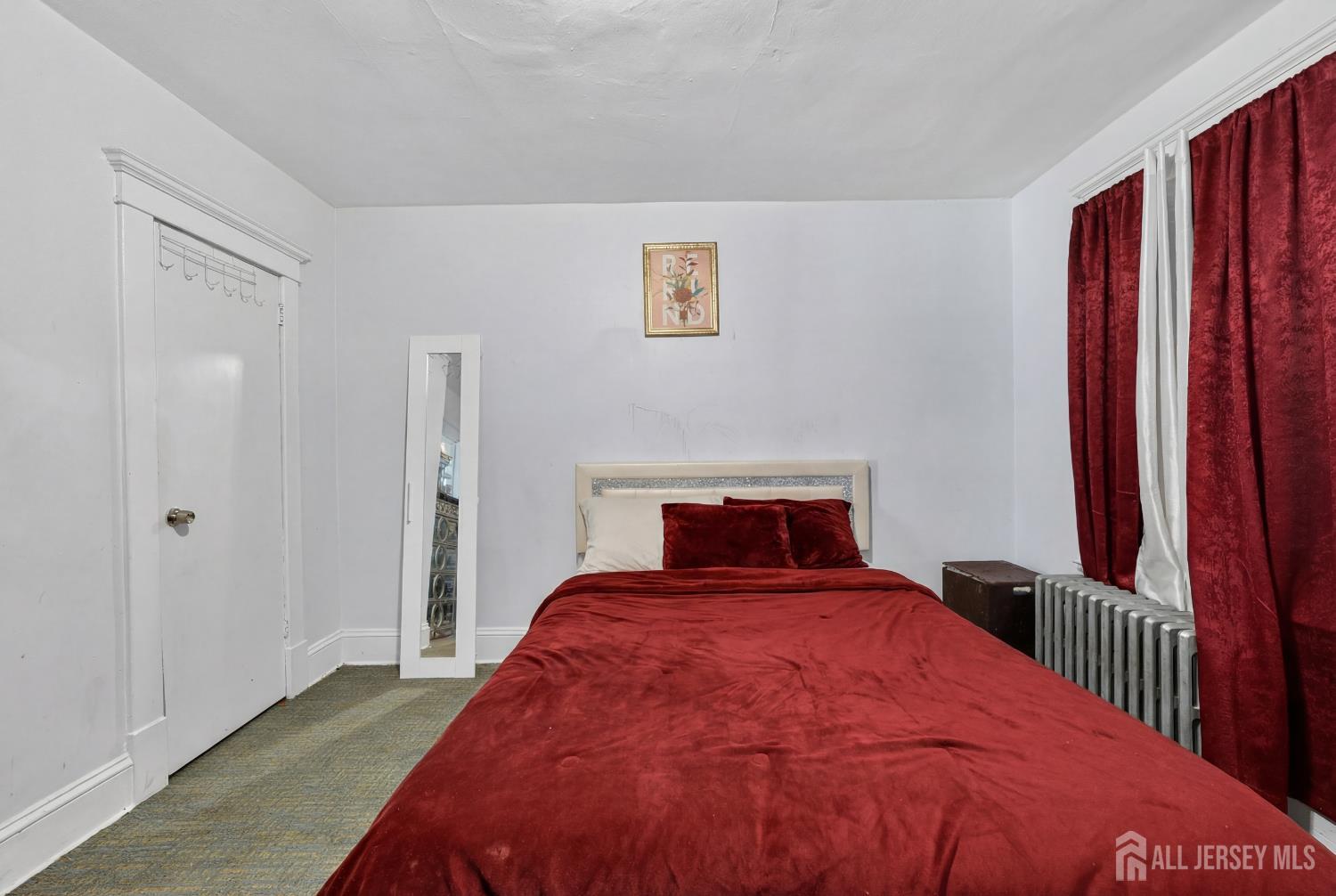 361 Prospect Street Perth Amboy, NJ 08861 - Photo 22 of 50 a bedroom with a bed and a window