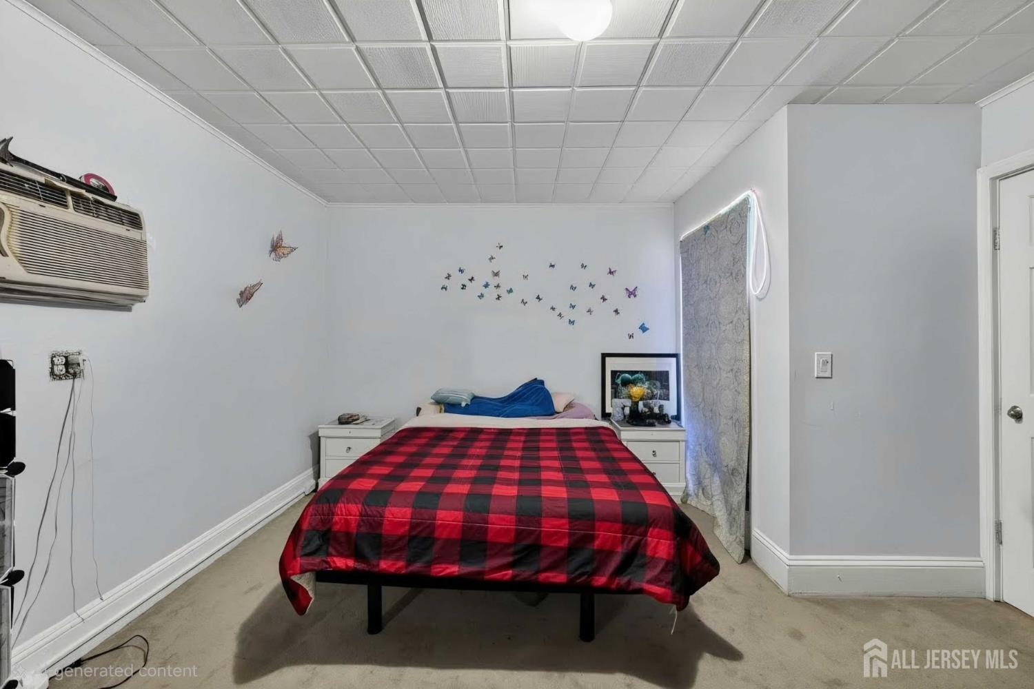 361 Prospect Street Perth Amboy, NJ 08861 - Photo 25 of 50 a bed sitting in a bedroom next to a window