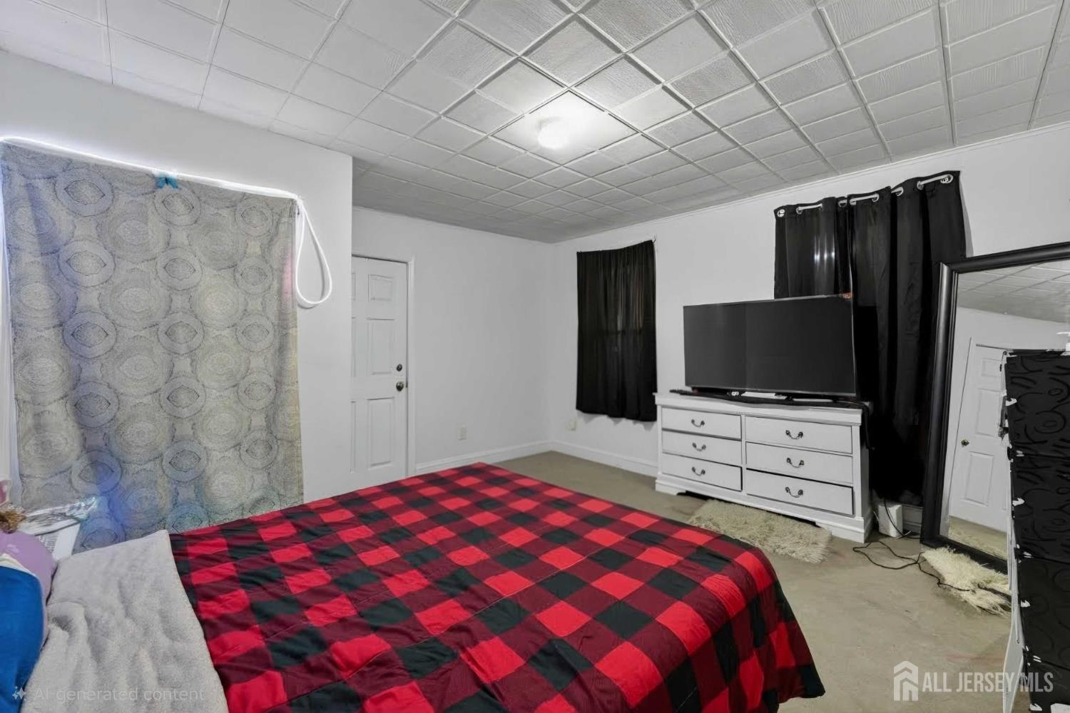 361 Prospect Street Perth Amboy, NJ 08861 - Photo 26 of 50 a bedroom with a bed and a flat screen tv