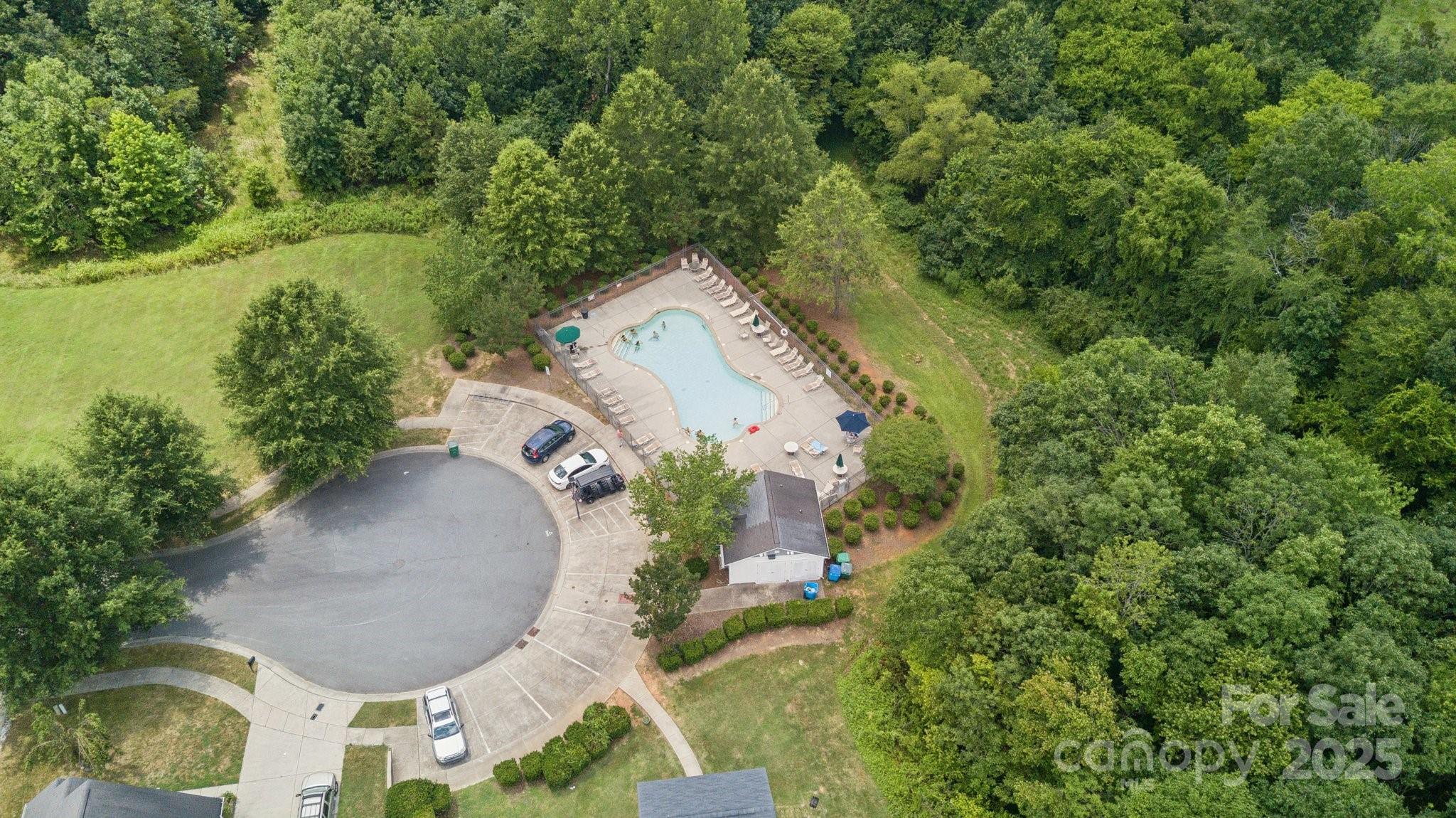 8160 Thornton Street Locust, NC 28097 - Photo 5 of 5 an aerial view of a house with outdoor space and trees all around