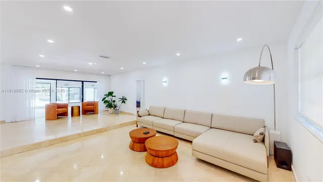 a living room with furniture and a table
