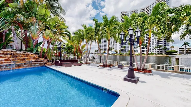 a swimming pool with outdoor seating and yard