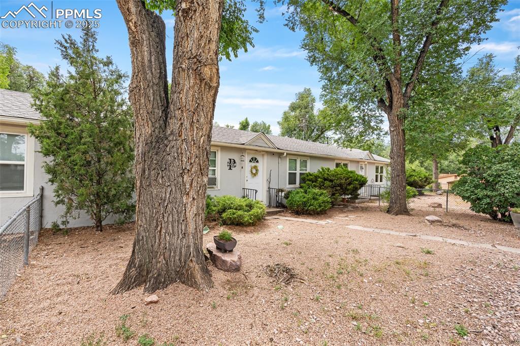 317 West Harrison Street Colorado Springs, CO 80907 - Photo 1 of 22 View of front of triplex (3 units that each have 2 beds/1 bath)