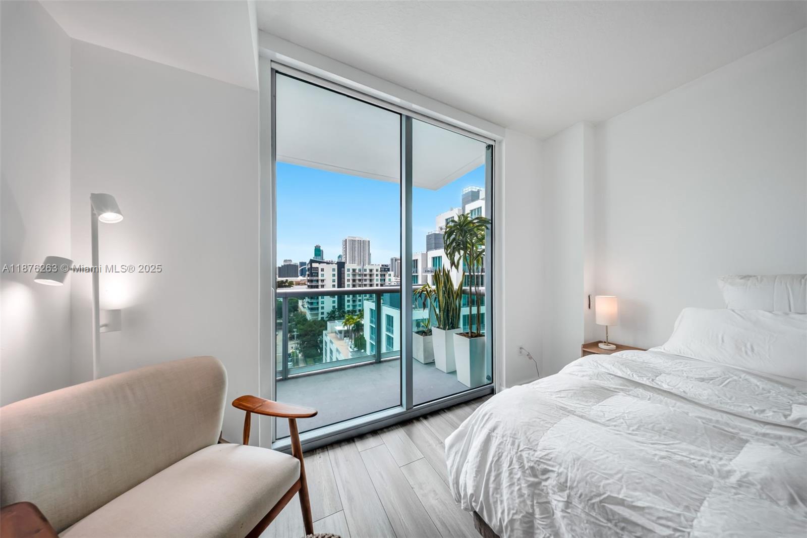 333 Northeast 24th Street, Unit 1111 Miami, FL 33137 - Photo 17 of 39 a bedroom with a bed and a window