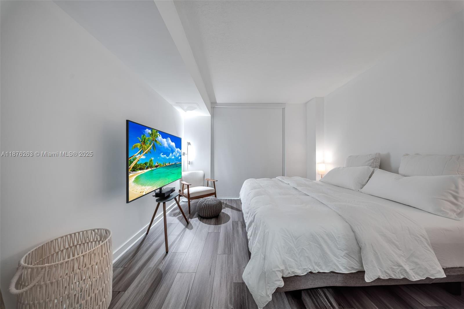 333 Northeast 24th Street, Unit 1111 Miami, FL 33137 - Photo 20 of 39 a bedroom with a bed and a flat screen tv