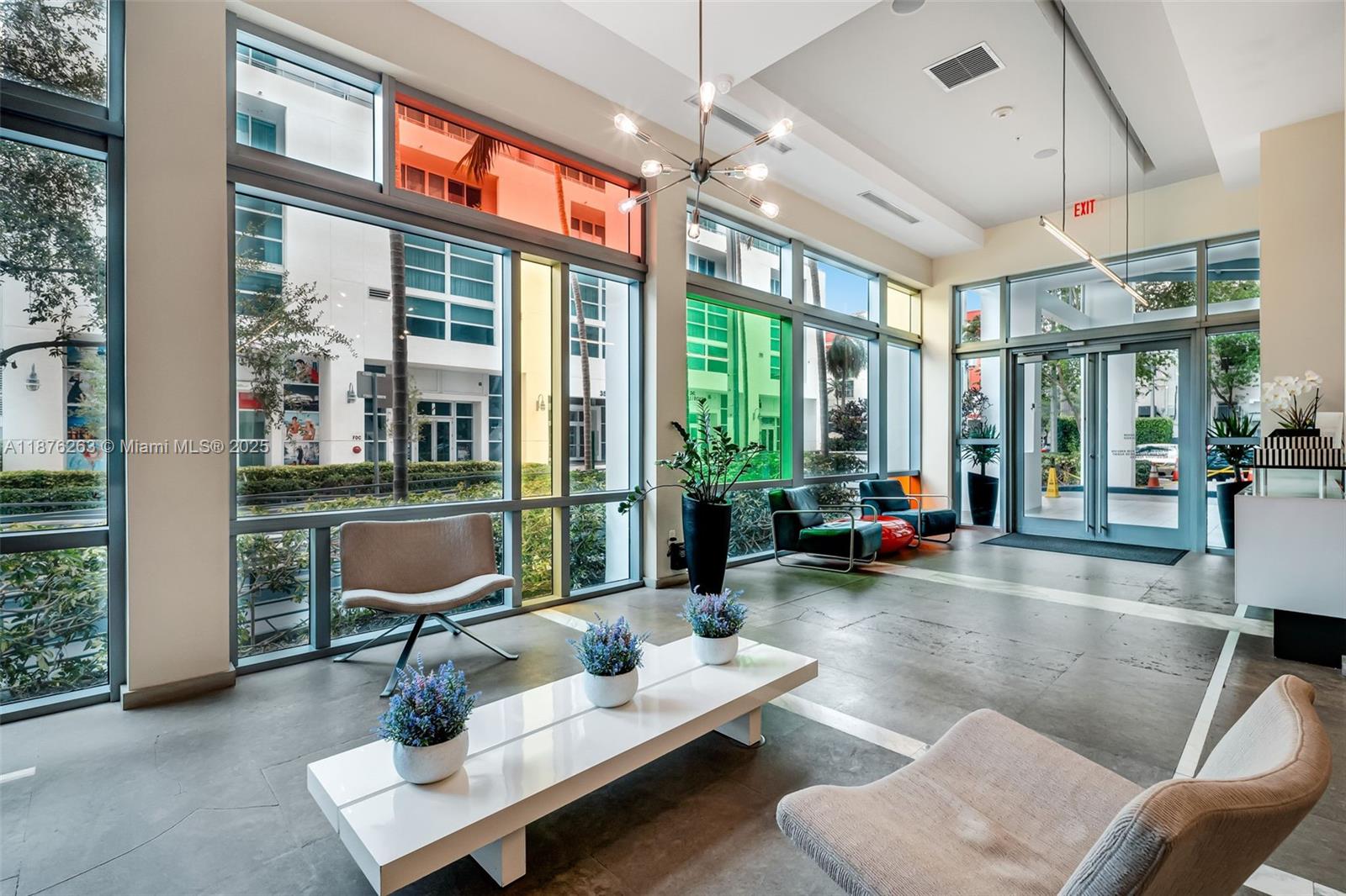 333 Northeast 24th Street, Unit 1111 Miami, FL 33137 - Photo 2 of 39 a living room with furniture and a large window