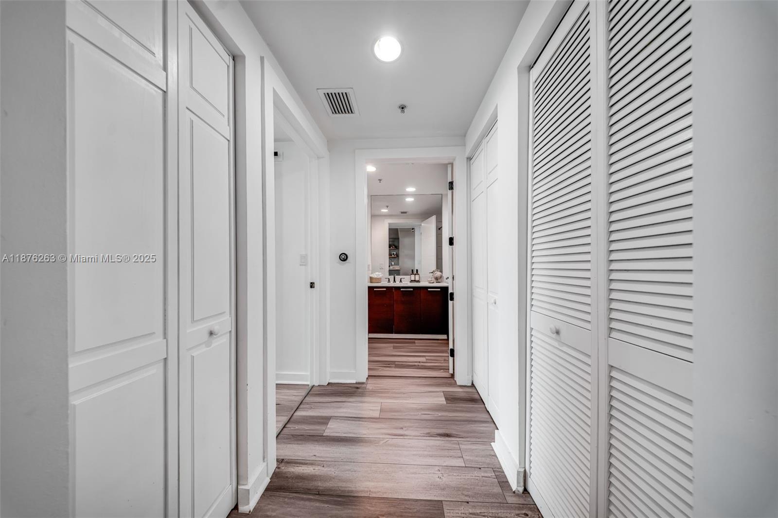 333 Northeast 24th Street, Unit 1111 Miami, FL 33137 - Photo 22 of 39 a view of a hallway with wooden floor