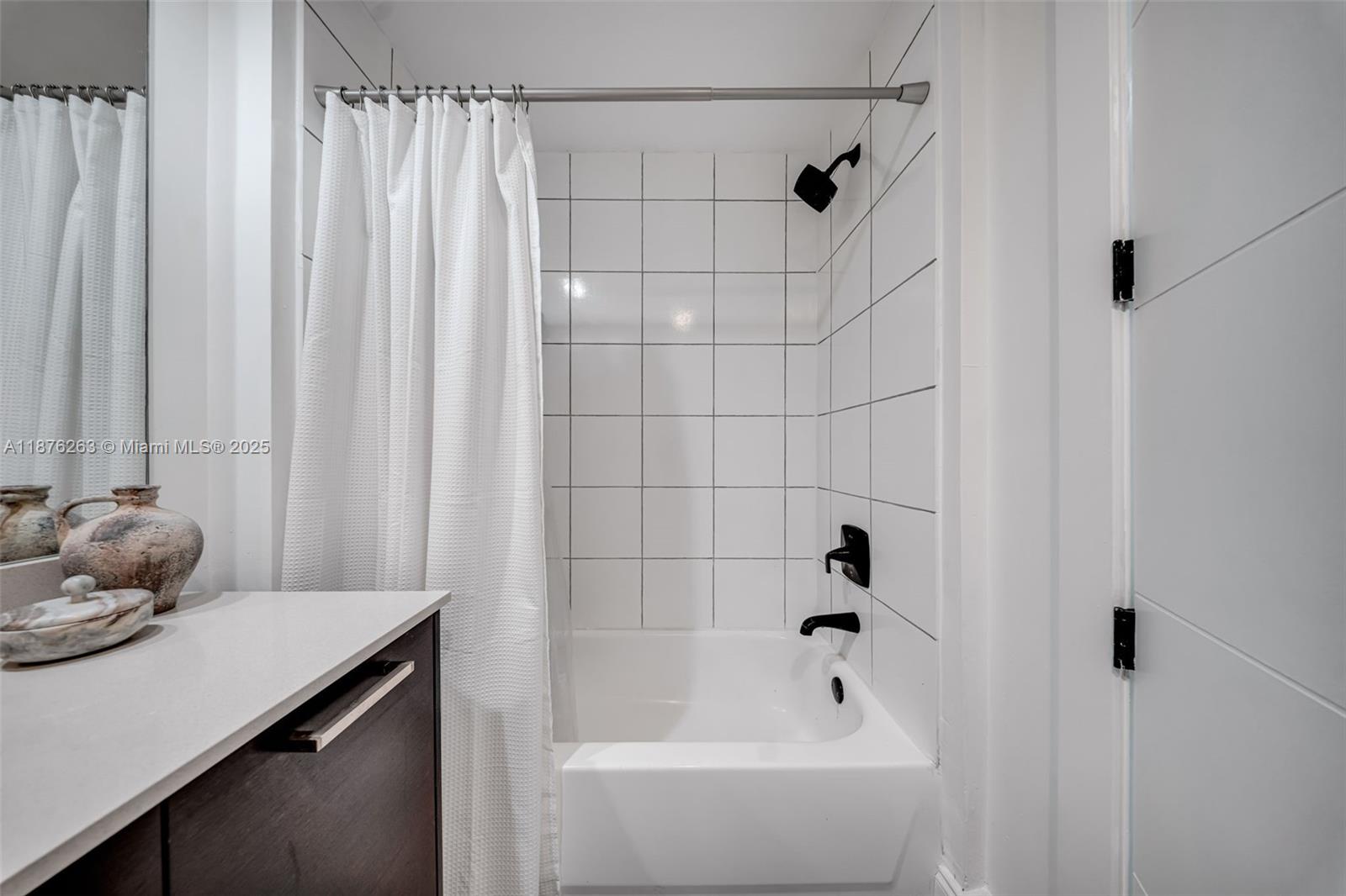 333 Northeast 24th Street, Unit 1111 Miami, FL 33137 - Photo 25 of 39 a bathroom with a bathtub and shower