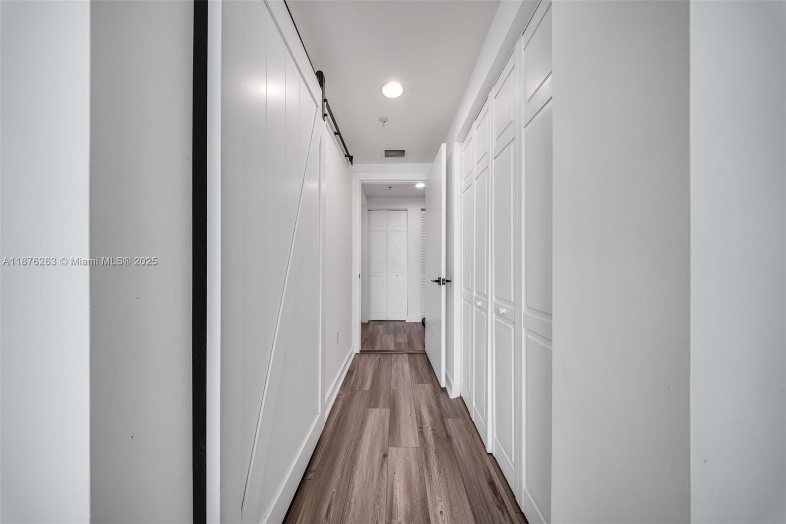 333 Northeast 24th Street, Unit 1111 Miami, FL 33137 - Photo 26 of 39 a view of a hallway with wooden floor and staircase
