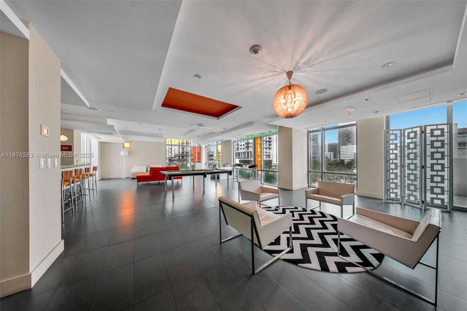 333 Northeast 24th Street, Unit 1111 Miami, FL 33137 - Photo 31 of 39 a dining room with furniture and a large window