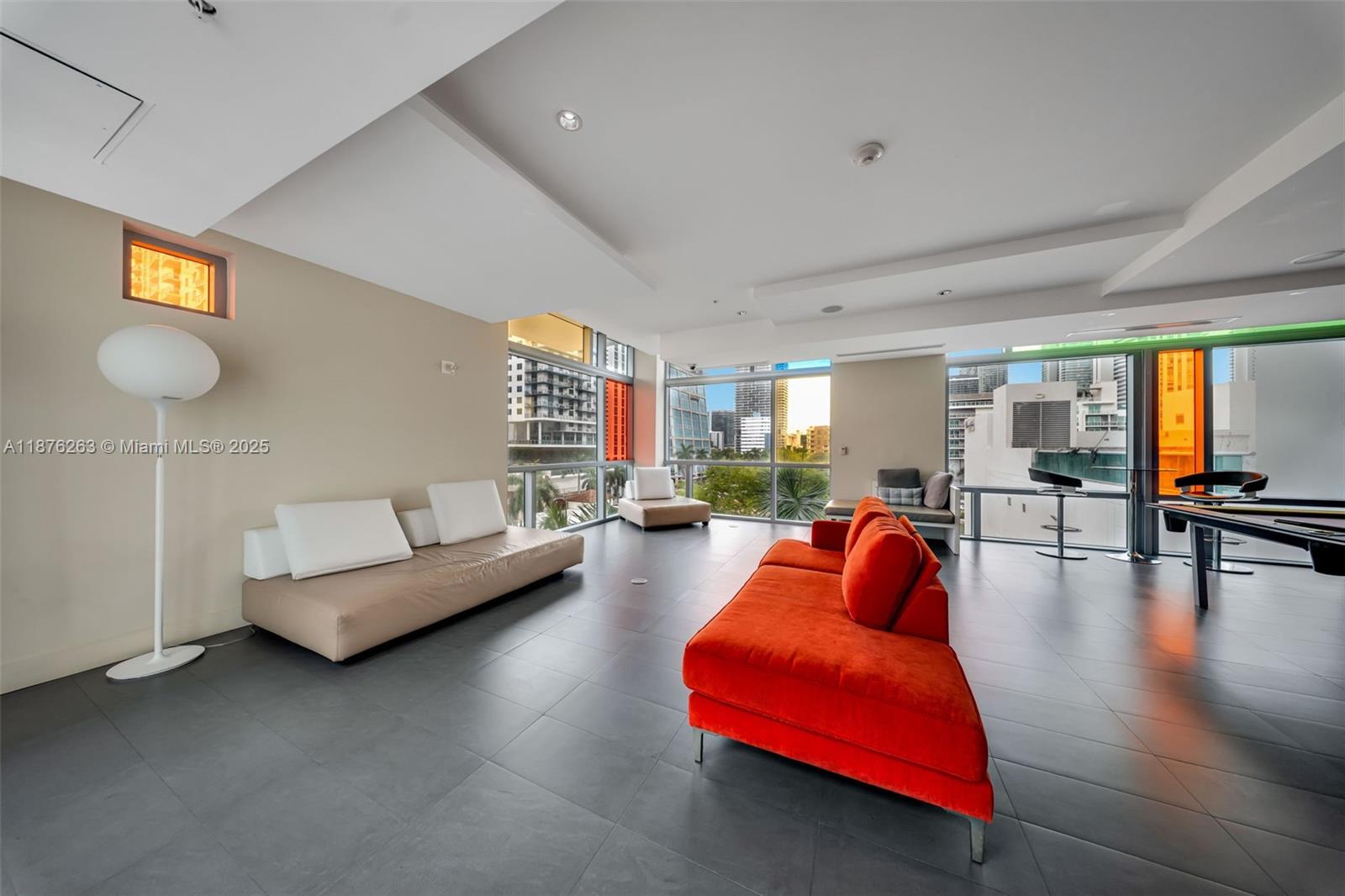 333 Northeast 24th Street, Unit 1111 Miami, FL 33137 - Photo 34 of 39 a living room with furniture and a table