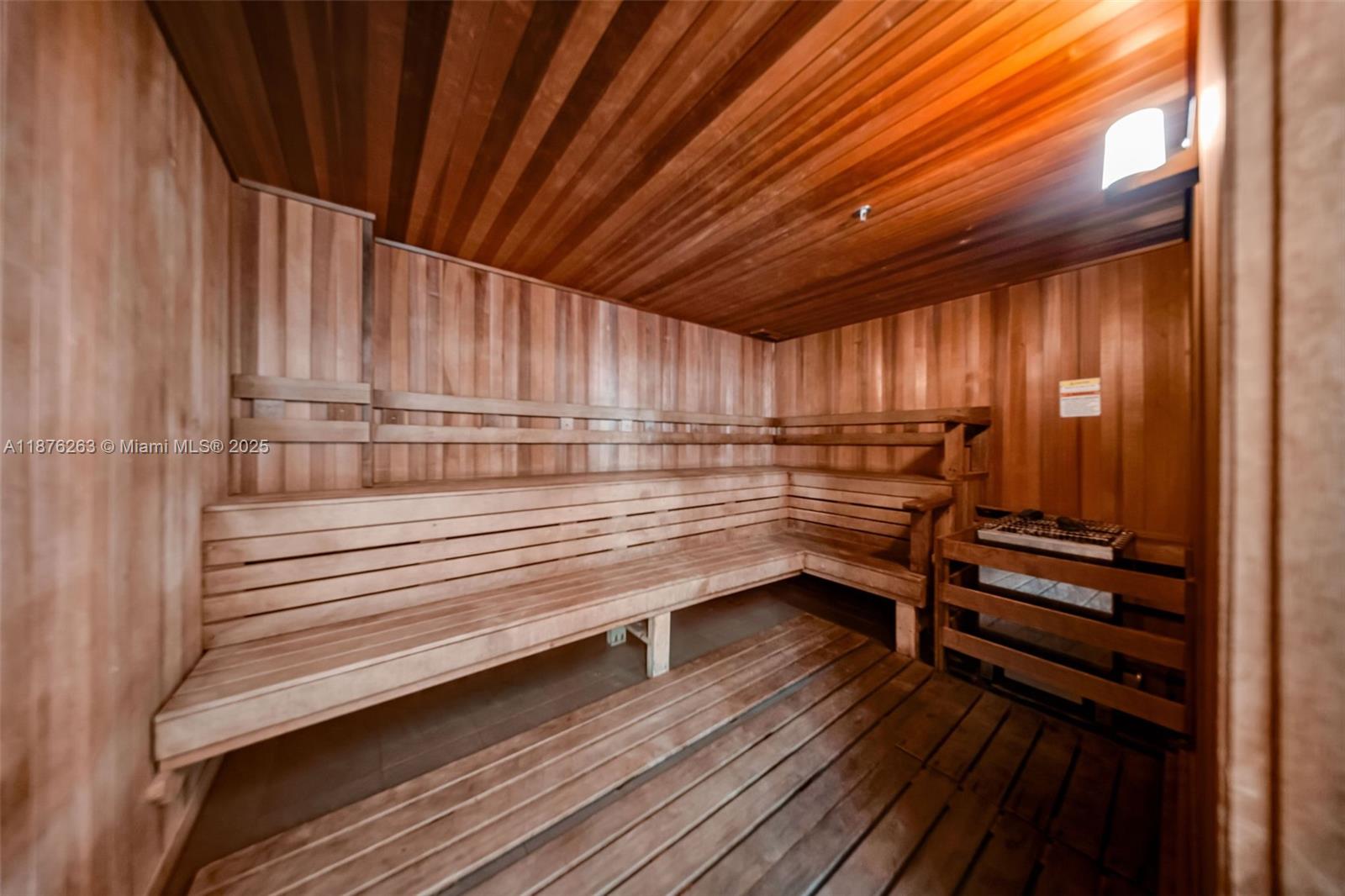 333 Northeast 24th Street, Unit 1111 Miami, FL 33137 - Photo 37 of 39 a kitchen with wooden cabinets and outdoor space