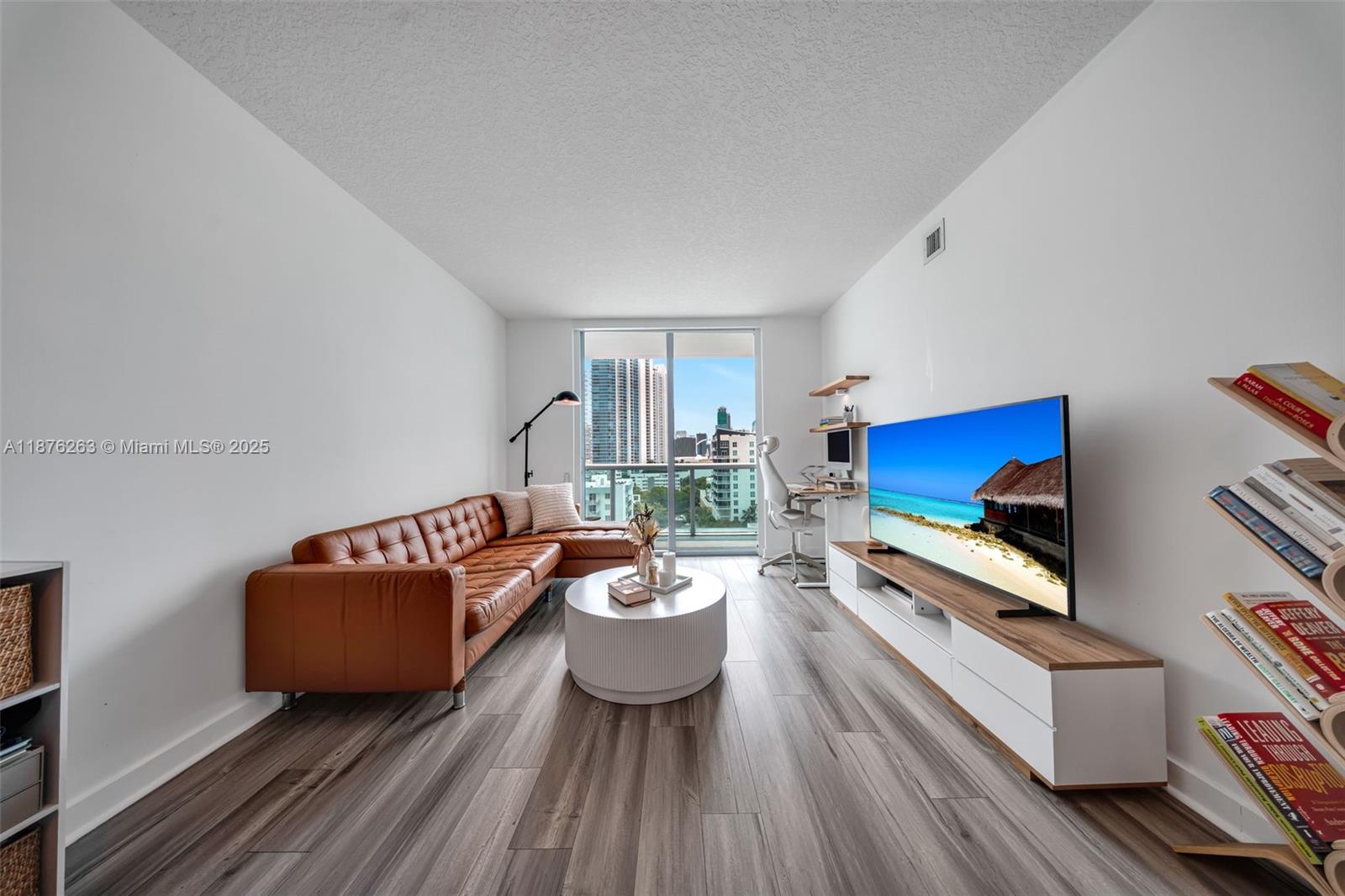 333 Northeast 24th Street, Unit 1111 Miami, FL 33137 - Photo 5 of 39 a living room with furniture and a couch