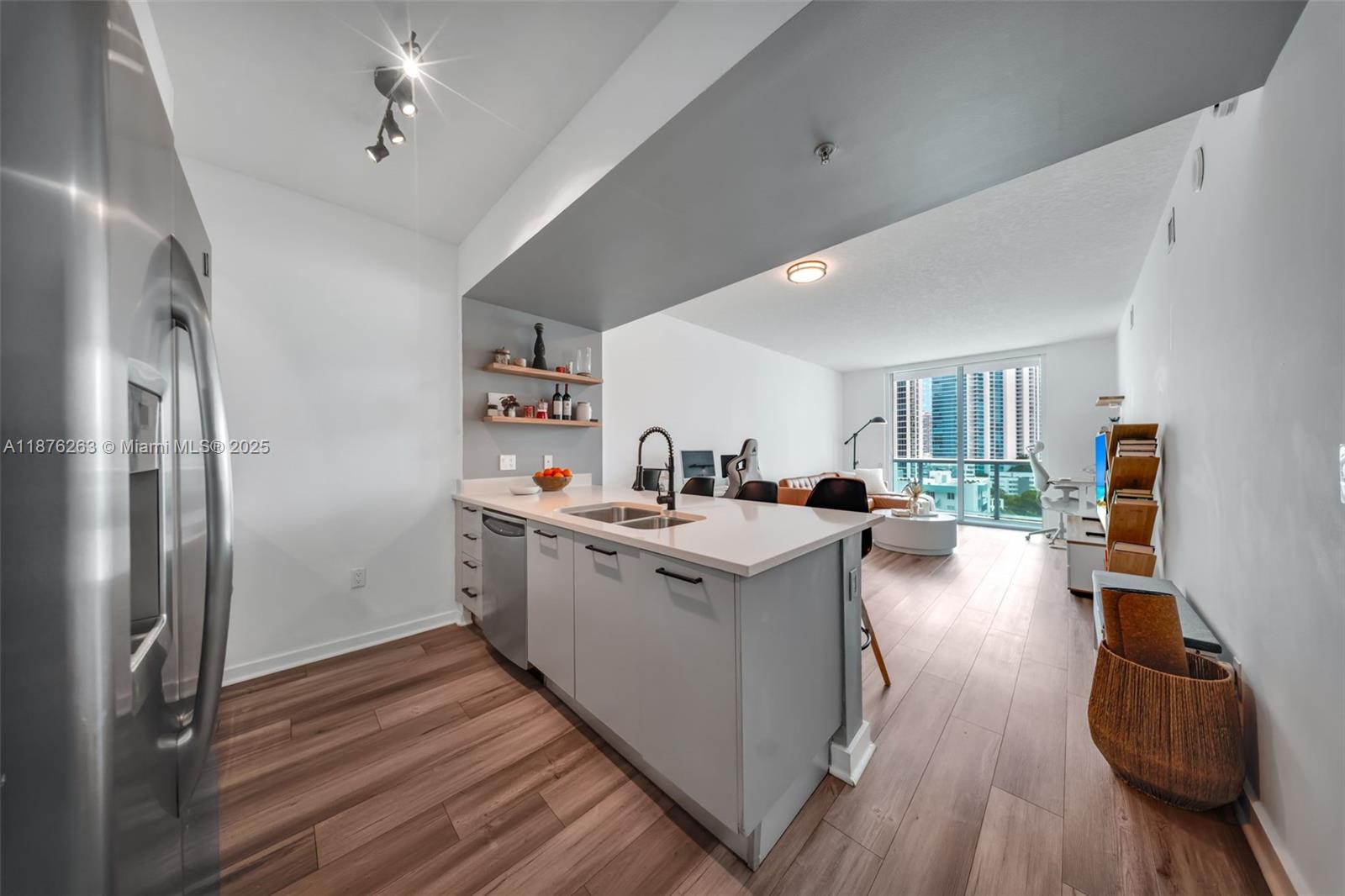 333 Northeast 24th Street, Unit 1111 Miami, FL 33137 - Photo 10 of 39 a view of living room with furniture and a wooden floor