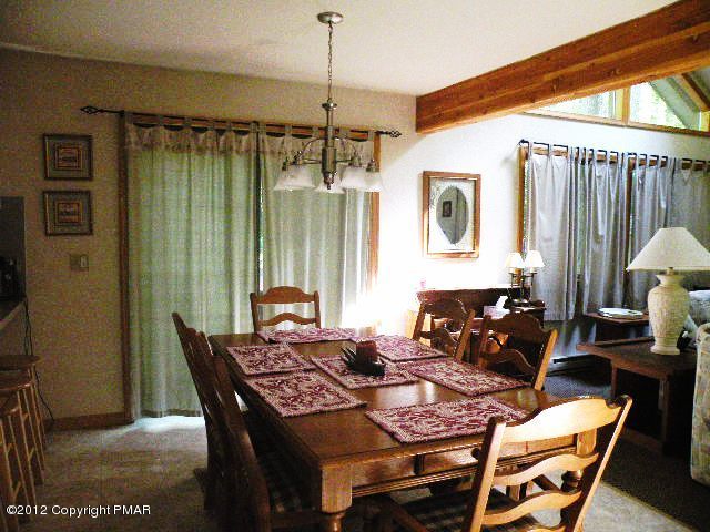138 Elk Run Road Pocono Lake, PA 18347 - Photo 5 of 16 a dining room with furniture and window