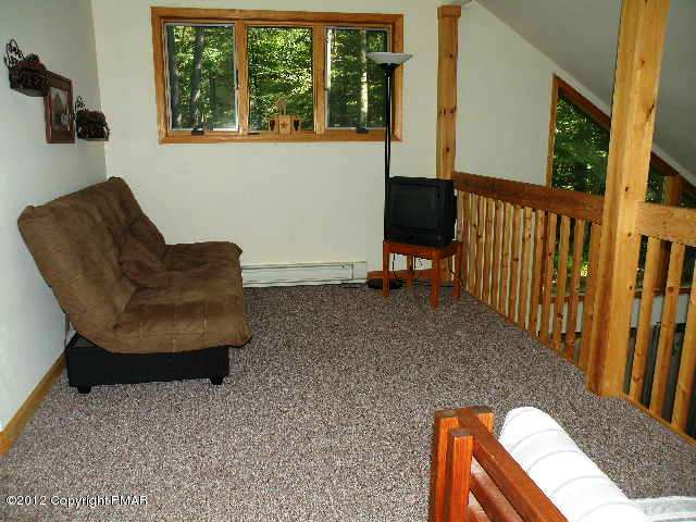 138 Elk Run Road Pocono Lake, PA 18347 - Photo 10 of 16 a view of balcony with furniture and a window