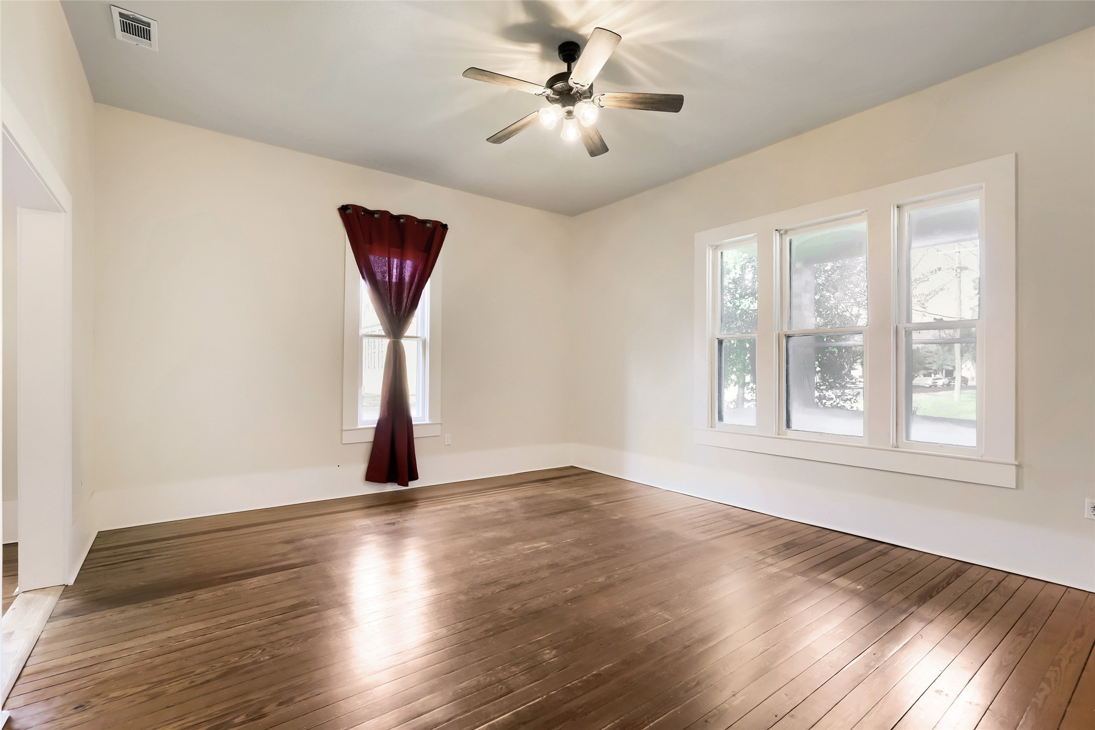 208 North Ave B Elgin, TX 78621 - Photo 14 of 29 Living room with porch window view.