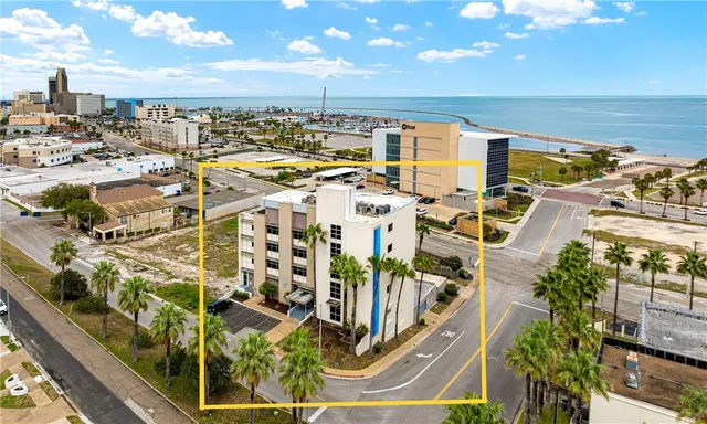 a kitchen with granite countertop white cabinets sink and stainless steel appliances