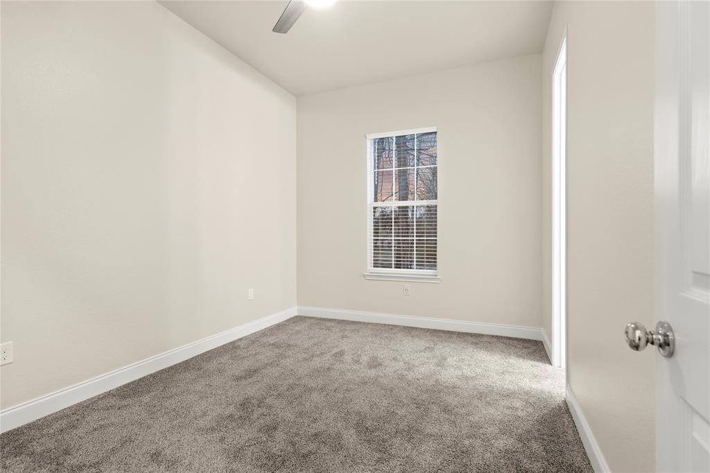 503 South 5th Street Bonham, TX 75418 - Photo 14 of 22 an empty room with windows